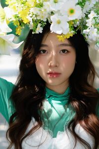 Captivating Smile: Young Woman in Green Embraces Nature's Serenity 1000019864-4