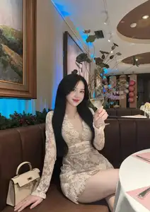 Captivating Beauty: Young Woman in Elegant Lace Dress Shines in Luxurious Restaurant Setting.-6