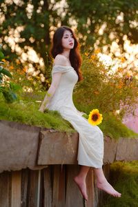 XVG No.2: Serene Beauty A Vietnamese Girl Amidst a Vibrant Flower Garden-1