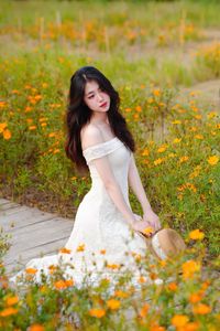 XVG No.2: Serene Beauty A Vietnamese Girl Amidst a Vibrant Flower Garden-6