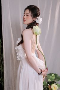 Elegant Vietnamese Girl in White, Embracing Tea Ceremony and Lotus Flowers – Traditional Beauty.-7