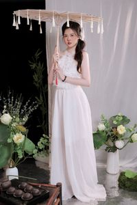 Elegant Vietnamese Girl in White, Embracing Tea Ceremony and Lotus Flowers – Traditional Beauty.-8