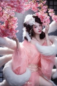 Mesmerizing Nine-Tailed Fox Cosplay: Ethereal Beauty in a Cherry Blossom Garden-12