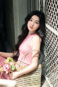 Vietnamese Grace: Elegant Girl in Traditional Flower Market, Discover Vibrant Culture 1000019476-10