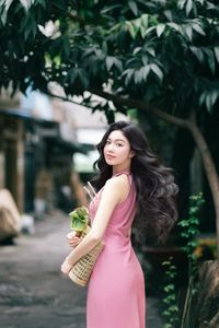 Vietnamese Grace: Elegant Girl in Traditional Flower Market, Discover Vibrant Culture 1000019476-8