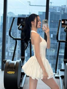 Gym Fashionista: Elegant woman in white bubble dress at a modern fitness center-4