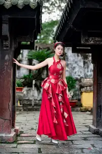 Elegant Asian Beauty in Red Dress Shines Gracefully Amidst a Traditional Garden 1000024509-4