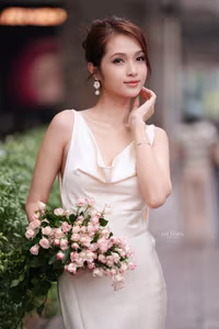 VGU No.11: Elegant Charm: A Woman's Grace in White Gown and Delicate Rose Bouquet-2
