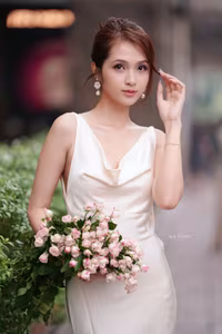 VGU No.11: Elegant Charm: A Woman's Grace in White Gown and Delicate Rose Bouquet-12