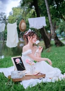 Serene Young Woman in White Dress Reading Book in Lush Nature-0