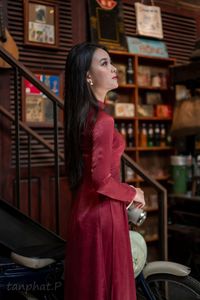 Discover Vietnamese Ao Dai Beauty: Elegant, Graceful Girl in a Cafe Setting-6