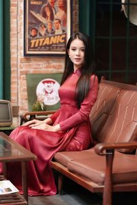 Discover Vietnamese Ao Dai Beauty: Elegant, Graceful Girl in a Cafe Setting-1