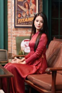 Discover Vietnamese Ao Dai Beauty: Elegant, Graceful Girl in a Cafe Setting-7