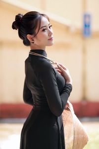 Graceful Vietnamese Woman in Elegant Black Ao Dai-2