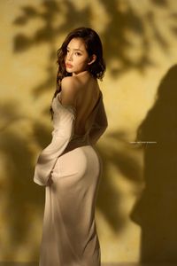 Elegant Allure: Woman's Grace in Shadow Play-11