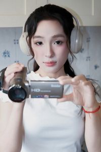 Young Woman Relaxing with Headphones & Music in Cozy Kitchen: Serene Home Lifestyle Moment-13