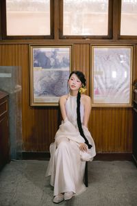 Captivating Asian Beauty: Elegant Young Woman with Braided Hair and Dreamy Gaze - 1000019730-1