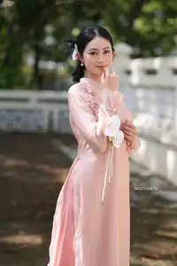 Timeless Beauty: Elegant Vietnamese Girl in Graceful Pink Ao Dai 1000024694-9
