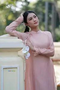 Timeless Beauty: Elegant Vietnamese Girl in Graceful Pink Ao Dai 1000024694-7