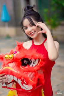 Vietnamese Cultural Beauty: Girl in Red Ao Dai & Traditional Lion Dance Prop-3