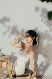 Beautiful Woman Enjoying Fresh Summer Peaches in a Lush Garden Setting, Healthy Lifestyle Inspiration.-0