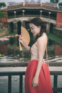 Vietnamese Woman's Beauty Amidst Hoi An Ancient Town, by Iconic Japanese Covered Bridge-0