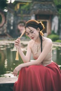 Vietnamese Woman's Beauty Amidst Hoi An Ancient Town, by Iconic Japanese Covered Bridge-3