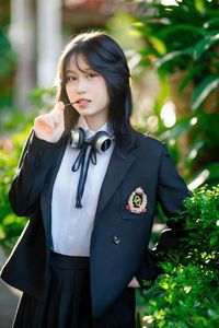 Discover the captivating smile of an Asian girl amidst vibrant nature-5