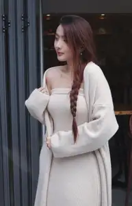 Discover the elegant charm of a gentle woman captured in a serene, thoughtful moment 176403855-8