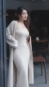 Discover the elegant charm of a gentle woman captured in a serene, thoughtful moment 176403855-6