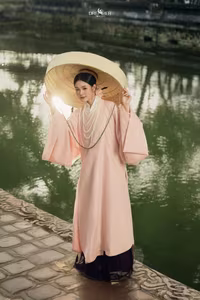 XVG No.50: Elegant Vietnamese Woman in Pink Traditional Dress, Conical Hat, Serene Beauty.-4