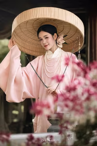 XVG No.50: Elegant Vietnamese Woman in Pink Traditional Dress, Conical Hat, Serene Beauty.-5