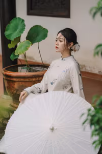 XVG No.29: Graceful Ao Dai - Unveiling the Serene Beauty of a Vietnamese Woman with Golden Blooms.-2