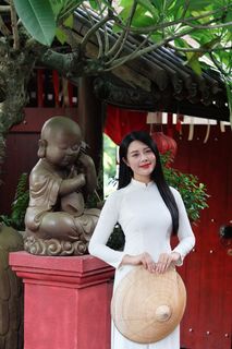 Elegant Vietnamese Woman in White Ao Dai Embracing Spirit of Independence-3