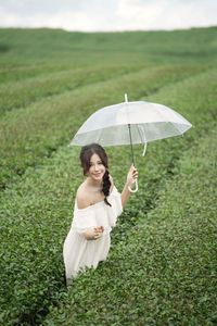 Serene Girl Embracing Nature & Book in Lush Green Tea Hill-1