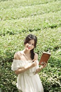 Serene Girl Embracing Nature & Book in Lush Green Tea Hill-9