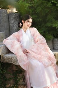 Explore East Asian Traditional Beauty: An Elegant Muse in Soft Pastel Attire.-2