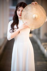 Graceful Vietnamese Girl in Pristine White Ao Dai: Timeless Beauty.-4