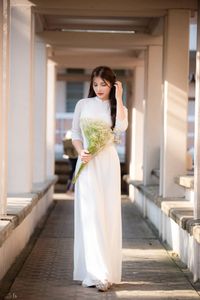 Graceful Vietnamese Girl in Pristine White Ao Dai: Timeless Beauty.-11