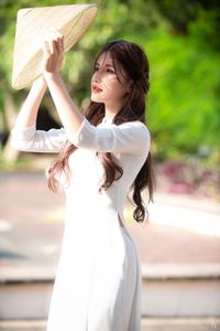 Graceful Vietnamese Girl in Pristine White Ao Dai: Timeless Beauty.-19