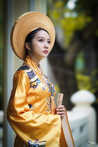 Traditional Vietnamese Beauty: Elegant Lady in Royal Attire & Conical Hat-0