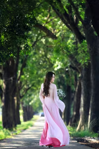 VGU No.150: Graceful Vietnamese Beauty in Pink Ao Dai on a Serene Path-1