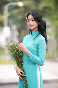 Vietnamese Ao Dai Beauty: Graceful Girl with Flowers.-10
