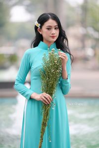 Vietnamese Ao Dai Beauty: Graceful Girl with Flowers.-6