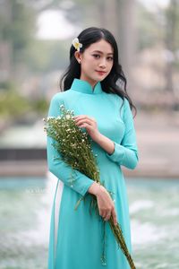 Vietnamese Ao Dai Beauty: Graceful Girl with Flowers.-11