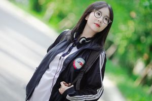 Radiant Youth: Girl in Uniform Playfully Blowing Bubbles in Lush Greenery 1000019736-8