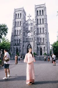 Elegant Woman in Pink Ao Dai at Hanoi Grand Cathedral - Vietnamese Cultural Charm-16