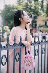 Elegant Woman in Pink Ao Dai at Hanoi Grand Cathedral - Vietnamese Cultural Charm-3