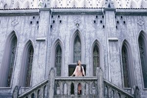 Elegant Woman in Pink Ao Dai at Hanoi Grand Cathedral - Vietnamese Cultural Charm-6