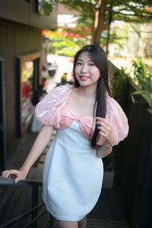 Radiant smile of a young, elegant Vietnamese girl in a pink and white dress.-3